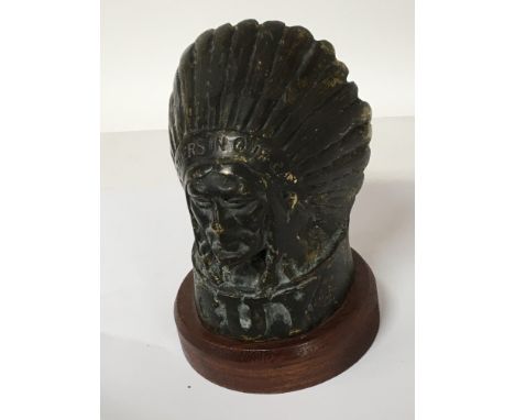 A cast bronze car Mascot in the form of an Indian chief GUY Father in our car on a later mahogany plinth. Height 15cm.