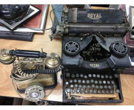 A vintage Royal typewriter and a telephone. This lot cannot be posted