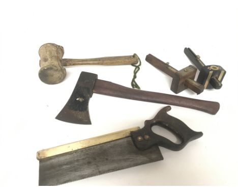 A Collection of Victorian carpenter tools, a Tennon saw with brass rib, leather mallet, two scribes and an axe. This lot cann