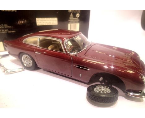 Auto Art 1:18 scale Aston Martin DB5 burgundy in excellent condition. P&P Group 1 (£14+VAT for the first lot and £1+VAT for s