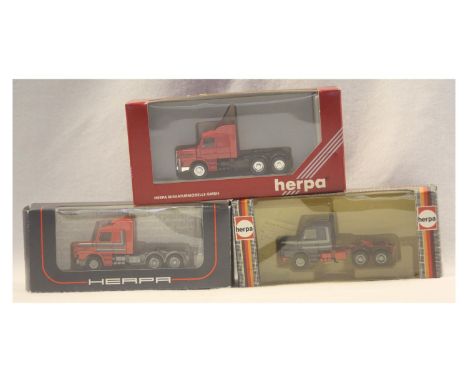H0 Vehicles, 1x Herpa 141451 Scania tractor, black chassis red cab and wind spoilers, 1x Herpa 836270 Volvo tractor, red chas