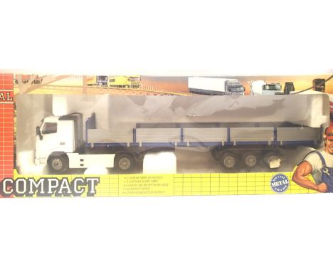 Joal 1:50 scale Volvo FH12 with low sided trailer in very good - excellent condition, boxed. P&amp;P Group 2 (£18+VAT for the