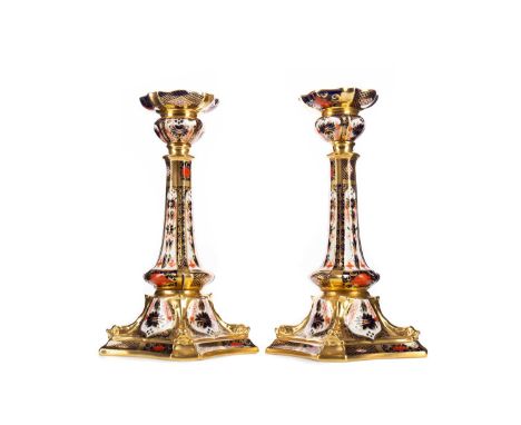 PAIR OF ROYAL CROWN DERBY IMARI CANDLESTICKS,No. 1128/XL11, 26.5cm high (2)Both are cracked through, one with further damage 