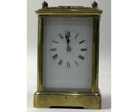 BRASS REPEATER CARRIAGE CLOCK, EARLY 20TH CENTURY  with swing handle, the white enamel dial with numerals in black14cm high 