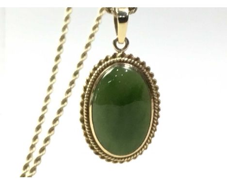 FIFTEEN CARAT GOLD OVAL PENDANT, on a nine carat gold chainWeight of chain is 2.34 grams. Weight of pendant is 5.23 grams.