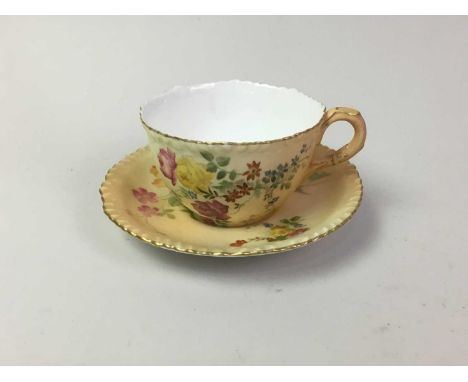 ROYAL WORCESTER, BLUSH IVORY CABINET CUP AND SAUCER, decorated with flowers, green printed marks to basethe saucer 12cm diame