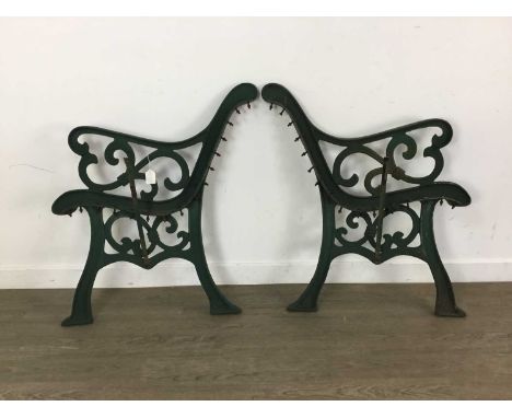 PAIR OF CAST IRON BENCH ENDS, painted green