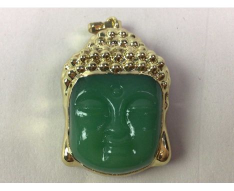 JADE PENDANT,  IN THE FORM OF A BUDDHA HEAD set in yellow metal