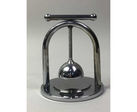 JACQUES ADNET, ART DECO CHROME PLATED LEMON SQUEEZER, EARLY-MID 20TH CENTURY stamped Foreign to base, along with a silver pla