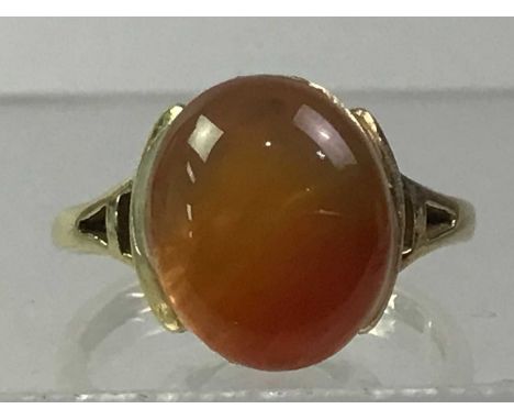 CARNELIAN DRESS RING, the cabochon cut oval stone set in nine carat goldTotal weight 3.43 grams. Size is 2.4cm by 1.7cm.