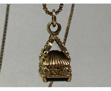 NINE CARAT GOLD NECKLACE, the pendant with scrolls and foliage, stamped 375Qty: 8gChain is 9ct gold