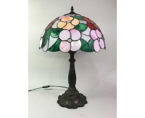 TIFFANY STYLE TABLE LAMP, with stained and leaded shade, the base of naturalistic form63cm highOverall good condition with no