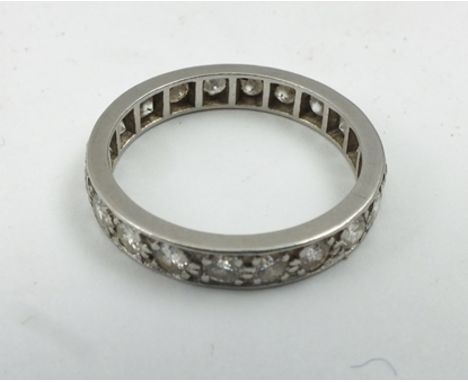 A DIAMOND SET ETERNITY RING, set in white gold or platinum, size O easy 