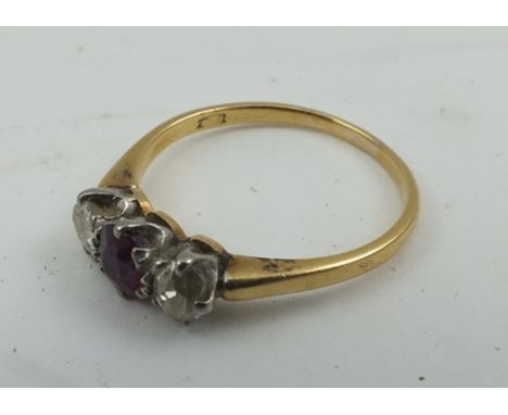 A RUBY AND DIAMOND LADY'S RING, on yellow metal band, size P 
