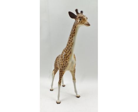 A BESWICK CERAMIC GIRAFFE, 32cm high 