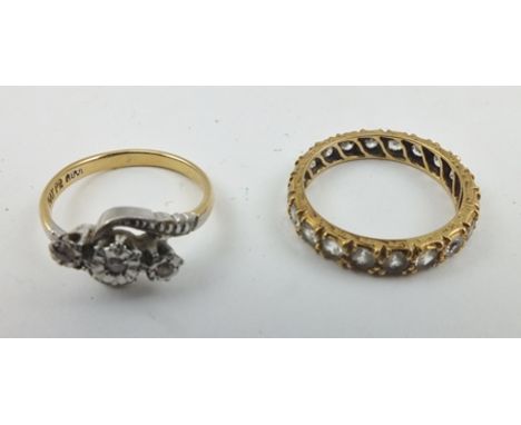 A DIAMOND EFFECT SET ETERNITY RING, decoratively chased yellow metal band, size M, together with a DIAMOND RING in 18ct gold 