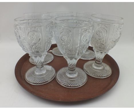 A SET OF SIX BACCARAT MOULDED WINE GLASSES, the bowls with panels of acanthus leaf, on twisted stems with platform bases 