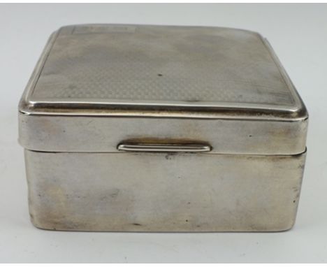 A SILVER CIGARETTE BOX, engine turned hinged cover, London 1926, 8.5cm wide 