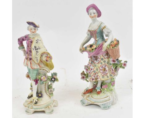 Two Continental porcelain figures, height 21.5 and 24.5cm.Condition Report: The smaller figure has extensive damage including
