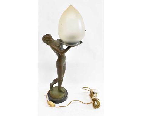 An Art Deco spelter table lamp modelled as a semi-naked female, her hands outstretched supporting the frosted glass shade, he