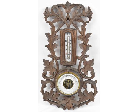 An early 20th century Black Forest style wall barometer/thermometer, height 43cm.