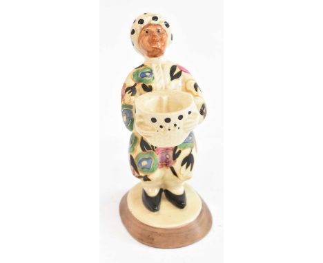 CLARICE CLIFF; an unusual figural candlestick, height 14.5cm.Condition Report: The figure has been broken and re-glued just a