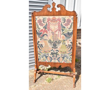 A large 19th century walnut and fret carved fire screen with inset tapestry panel, width 80.5cm, height 154cm.