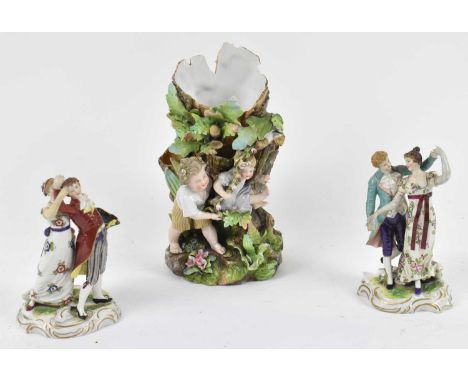 A pair of Continental porcelain figure groups of dancing couples, height 15cm (restorations), and a Continental spill vase de