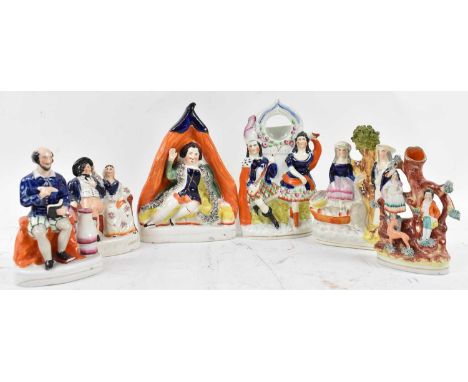 A group of six Staffordshire figures, including candlestick, height of tallest 25cm.