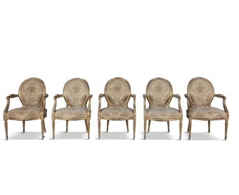 A SET OF FIVE FRENCH GILTWOOD FAUTEUILS IN LOUIS SEIZE TASTE, each with oval padded back and stuffed seat, covered in a flora