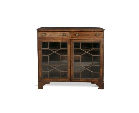 A GEORGE IV ROSEWOOD RECTANGULAR SIDE CABINET, fitted with twin frieze drawers with brass ring handles above twin astragal gl