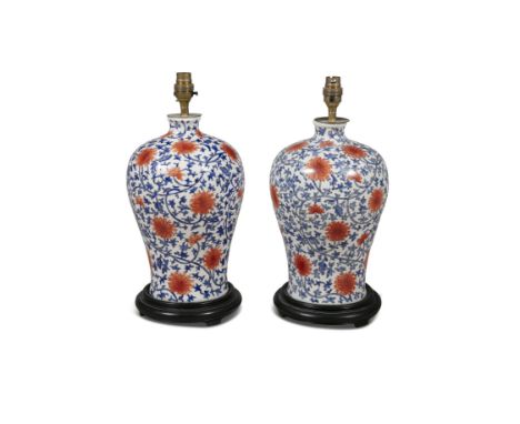 A PAIR OF MODERN CERAMIC TABLE LAMPS, of circular baluster form and decorated in the Chinese taste, raised on circular timber