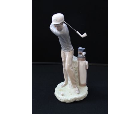 LLADRO - a Lladro figure of a golfer taking a strike at the ball, measures 29cm tall.