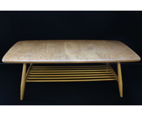 ERCOL - a Ercol rectangular elm coffee table, with shelf, measures 102cm x 46cm.