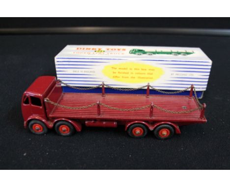 DINKY TOYS - a 905 Dinky die cast model Foden Flat Truck with chains in metallic red. Comes in original box, both in excellen