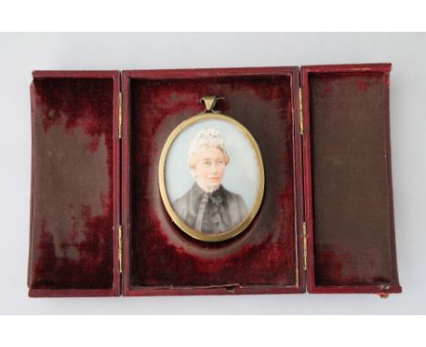 PORTRAIT MINIATURE - a Victorian miniature on ivory mounted in a burgundy leather frame stamped by Weson Sloane Sq London.  T