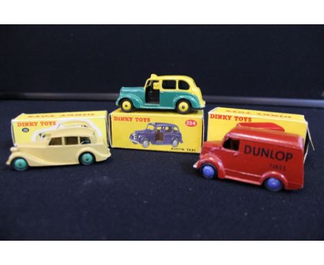 DINKY TOYS - a collection of 3 boxed Dinky die cast toy cars to include a 254 Austin Taxi (box and model in good-excellent co