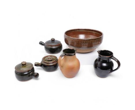 Collection of Winchcombe studio pottery, including various casserole dishes, two jugs and a large bowl, most with impressed m
