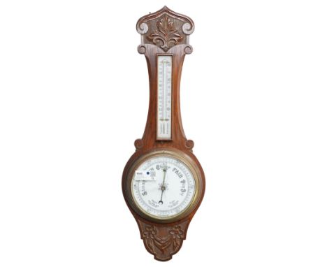 Aneroid barometer and thermometer in carved oak case