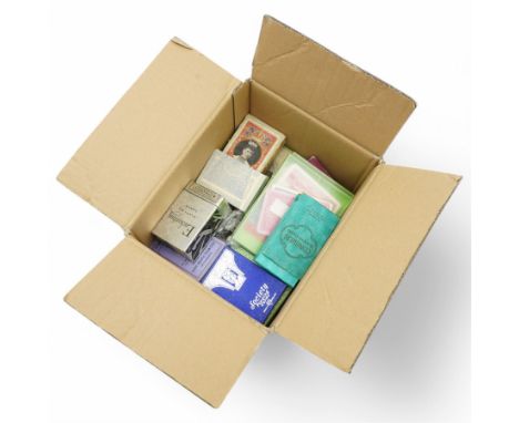 A box containing packs of vintage playing cards