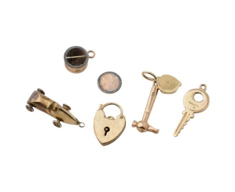 Five 9ct gold charms including hammer, Yale key, heart and carCondition Report:Approx 7.35gm, all tested, one broken