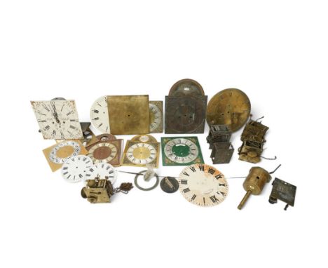 An 8-day longcase clock movement with a painted dial and various 8-day and 30-hour long case movements, dials, parts, plates,