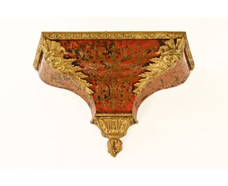 A 19th century boulle marquetry clock bracket, with applied metal mounts.  Height +/- 32 cm, width 53 cm, depth 22 cm (see il