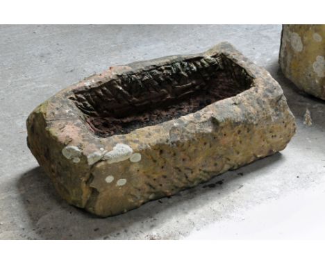 A rectangular sandstone trough.  Height 27 cm, width 76 cm, depth 36 cm.