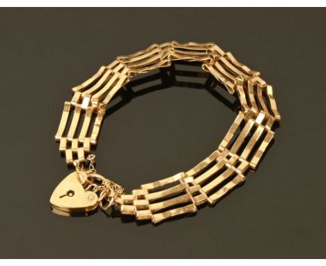 A 9 ct gold gate bracelet with safety chain and padlock, 9.5 grams.