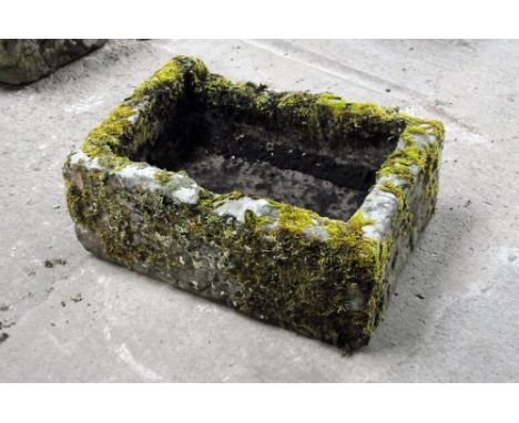 A rectangular sandstone trough, moss covered.  Height 26 cm, width 66 cm, depth 47 cm.