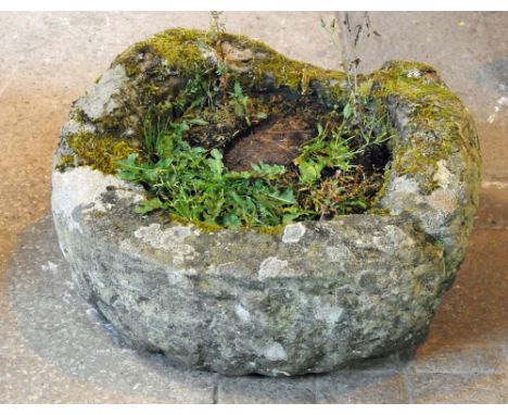 A circular sandstone trough.  Diameter +/- 56 cm, height 21 cm.
