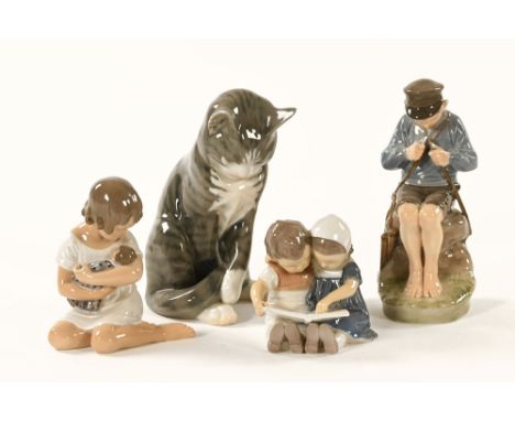 A group of four Royal Copenhagen figurines, to include a cat, young boy carving a stick, child with a baby and two small chil