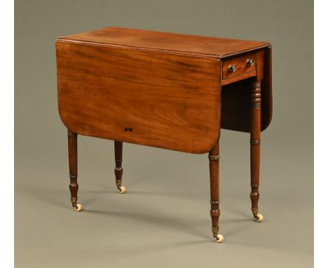 A late Georgian mahogany Pembroke table, with frieze drawer with brass knob handles and raised on turned tapered legs termina