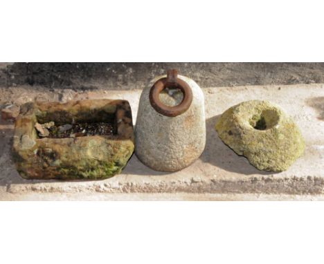 A small sandstone trough.  Height 13 cm, length 35 cm, depth 23 cm, together with a granite (possibly) counter weight.  Heigh